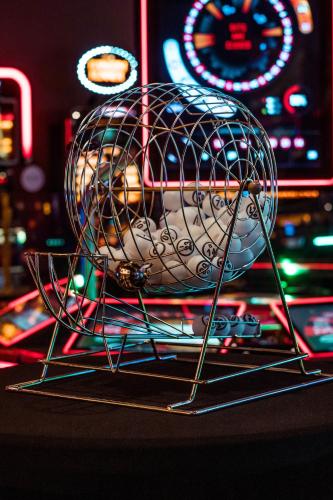 a metal wire basket with a donut in it at HOTELUX Amsterdam Airport Hotel in Hoofddorp