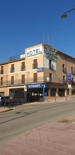 a building with a hotel on the side of a street at Hotel Segontia in Épila