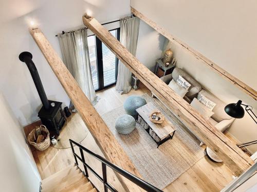 an overhead view of a living room with a wood stove at Landlebenliebe in Neukirchen