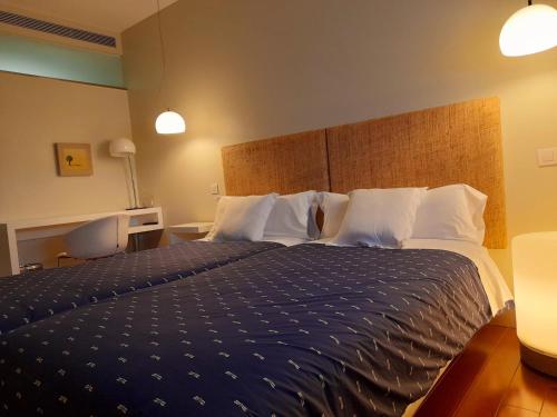 Tempat tidur dalam kamar di Hotel Ceres