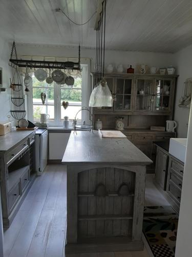 a kitchen with a island in the middle of it at Kehrmühle in Ober Kostenz