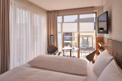 Postel nebo postele na pokoji v ubytování Hotel Misan