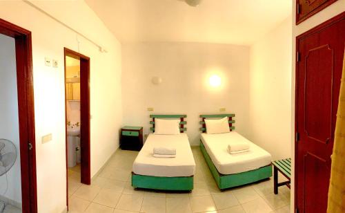 Ένα ή περισσότερα κρεβάτια σε δωμάτιο στο The Central Guesthouse