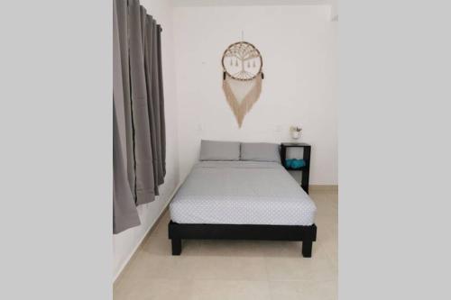 a bedroom with a bed in a room at Casa en Mahahual cerca de la playa D1 in Mahahual