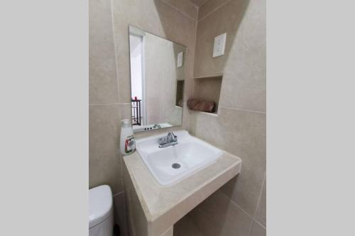 a bathroom with a sink and a toilet at Casa en Mahahual cerca de la playa D1 in Mahahual