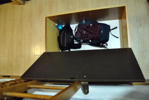 a table with a laptop on top of it at Ljubicica Hostel in Sarajevo