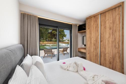 Ένα ή περισσότερα κρεβάτια σε δωμάτιο στο Aurum Villas