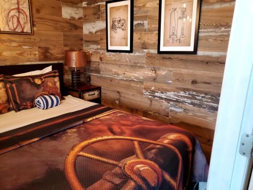 a bedroom with a bed and pictures on the wall at The Beach on Longboat Key in Longboat Key