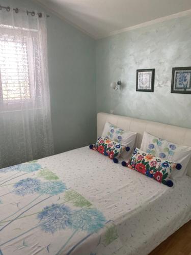 Una cama o camas en una habitación de Villa Mare Apartments