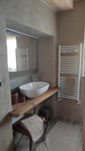 a bathroom with a white sink and a mirror at La Terra Buona guest house in Villa San Secondo