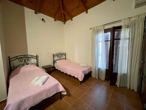 Postel nebo postele na pokoji v ubytování Serenita Cottage