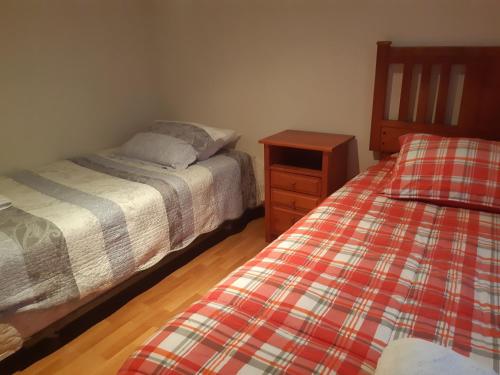Una cama o camas en una habitación de Portezuelo