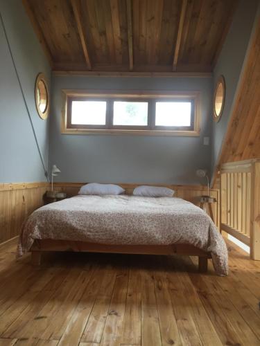 Cama o camas de una habitación en Cabaña La Lechuza