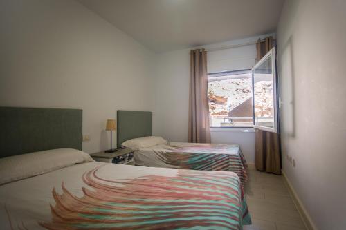 เตียงในห้องที่ Vistas al Mar junto a la Playa 2D