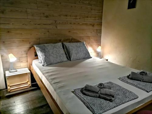 a bedroom with a bed with two towels on it at Apartments 18 in Velingrad