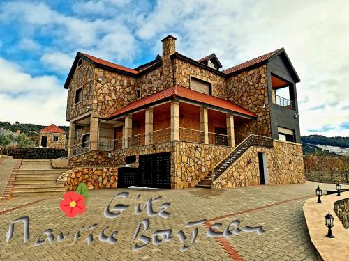 a large stone house with a large building at Maurice Bonjean in Ifrane