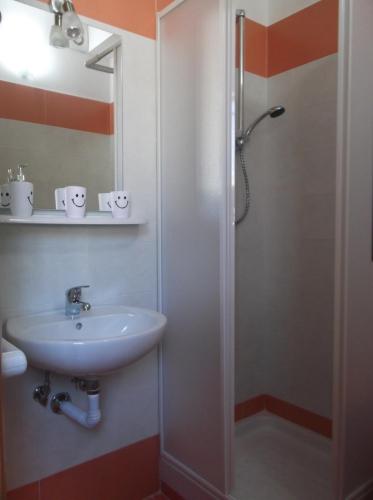 a bathroom with a sink and a shower at B&B Magna Grecia in Crotone