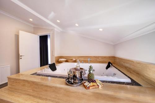 a large bathroom with a bath tub in a room at Etiz Hotels & Residences in Istanbul