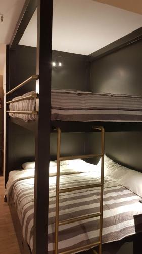 a couple of bunk beds in a room at BlueTel Lixouri in Lixouri