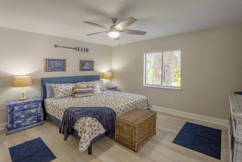 a bedroom with a bed and a ceiling fan at Indian Rocks Beach Unit B Star5Vacations in Clearwater Beach