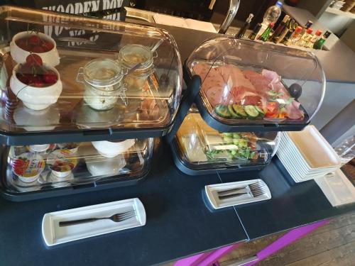 two trays of food sitting on a counter top at Rheinblick Hattenheim Boutique Art Gästehaus in Hattenheim
