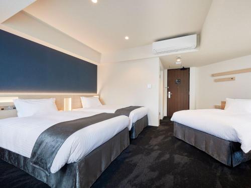 Una cama o camas en una habitación de Hotel Keyaki Gate Tokyo Fuchu