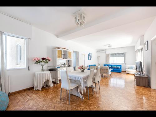 a dining room with a white table and chairs at Myria Court in Limassol