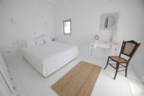 Giường trong phòng chung tại Casa Vento - Maisonette near Santa Maria beach