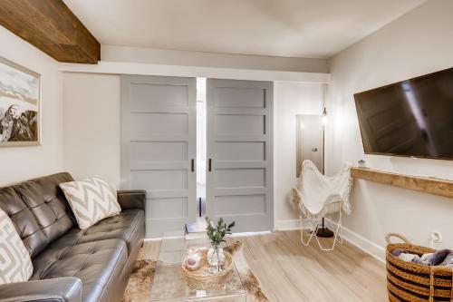 a living room with a couch and a tv at First Tracks 3105 condo in Steamboat Springs