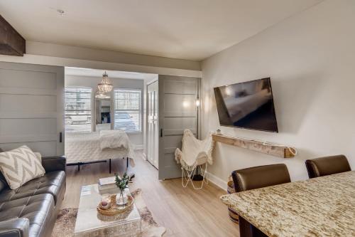 a living room with a couch and a table at First Tracks 3105 condo in Steamboat Springs