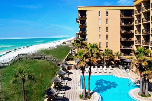 a view of the beach from the balcony of a resort at Wyndham Garden Fort Walton Beach Destin in Fort Walton Beach