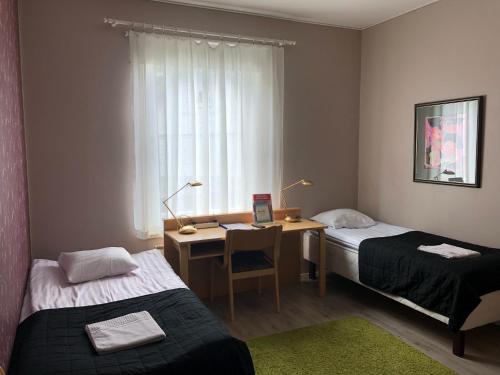 Un pat sau paturi într-o cameră la Hostel River