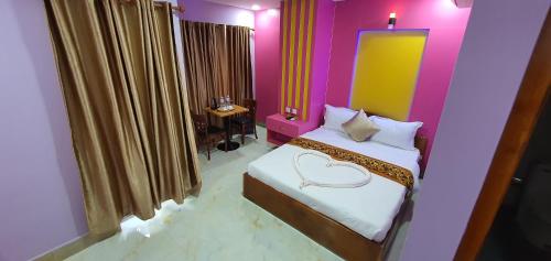 Ένα ή περισσότερα κρεβάτια σε δωμάτιο στο Pheng Chenda Hotel