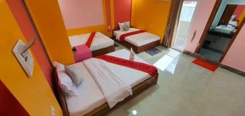 Ένα ή περισσότερα κρεβάτια σε δωμάτιο στο Pheng Chenda Hotel