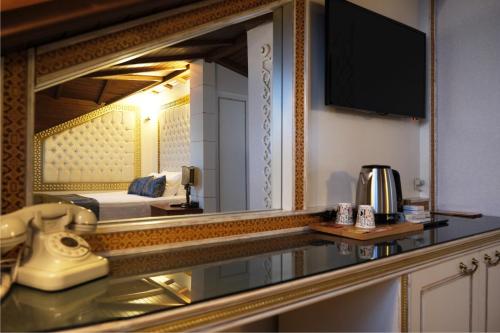 A television and/or entertainment centre at Castle Old Town Hotel