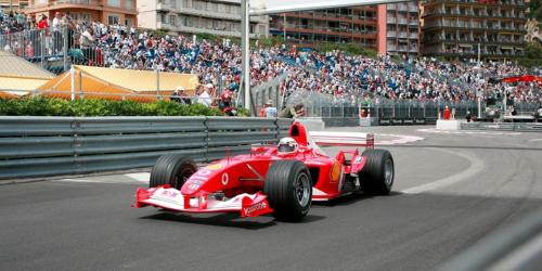 a red racing car on a track in front of a crowd at MONACO # MENTON - 4 PERSONS - PRIVATE PARKING - FULL RENOVATED - CLIM - CARRE OR - Beach & Sun in Menton