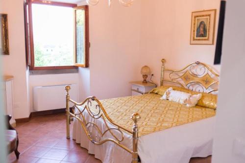 Säng eller sängar i ett rum på Antica Macina Toscana