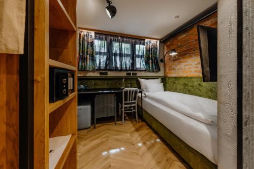 Postel nebo postele na pokoji v ubytování ONE66 Hotel