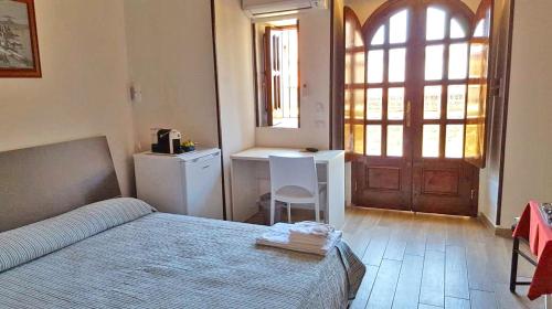A bed or beds in a room at casa vacanze mm rooms