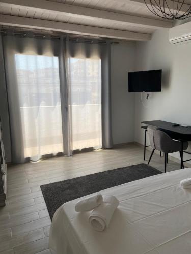 TV a/nebo společenská místnost v ubytování Minioto Rooms