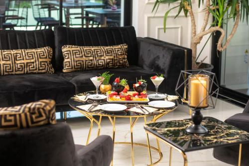 a living room with a table with food on it at THE NOVA HOTEL in Yalova