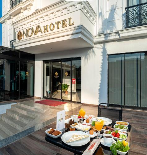 a buffet of food on a table in front of a building at THE NOVA HOTEL in Yalova