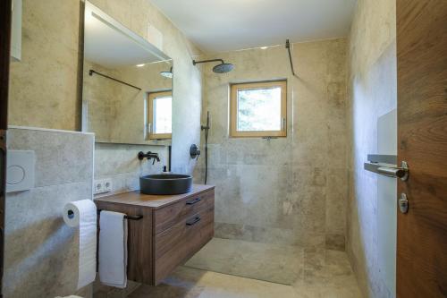 a bathroom with a sink and a mirror at Berghaus Turracherhöhe in Turracher Hohe