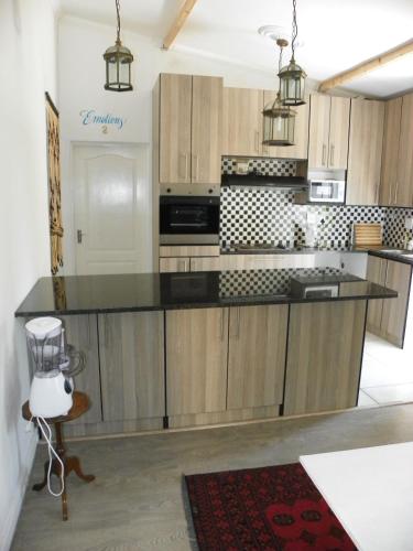 Una cocina o zona de cocina en Muco Guest House