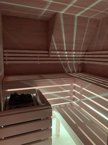 an empty room with lights on the floors and ceilings at Berghaus Turracherhöhe in Turracher Hohe