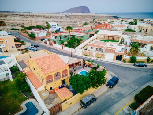 an aerial view of a small town with a street at Los Amigos NEST hostel in La Mareta
