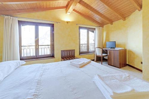 Postel nebo postele na pokoji v ubytování Hotel Grotto Bagat