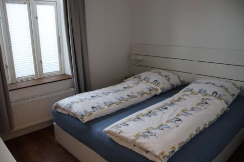 מיטה או מיטות בחדר ב-Altes Bahnhofsvorsteherhaus