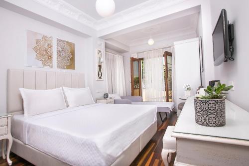 Postel nebo postele na pokoji v ubytování Ascot Hotel Büyükada