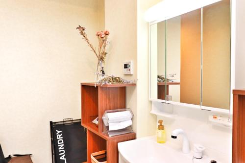 Ένα μπάνιο στο ゲストハウス WAKURIAN-Iwatacho